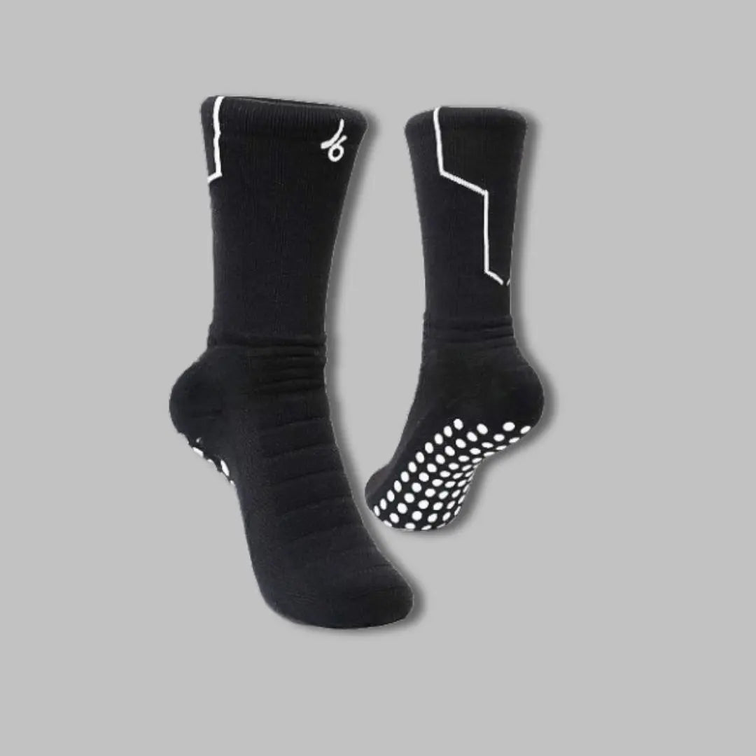 Chaussettes antidérapantes noirs Joga avec grip blanc